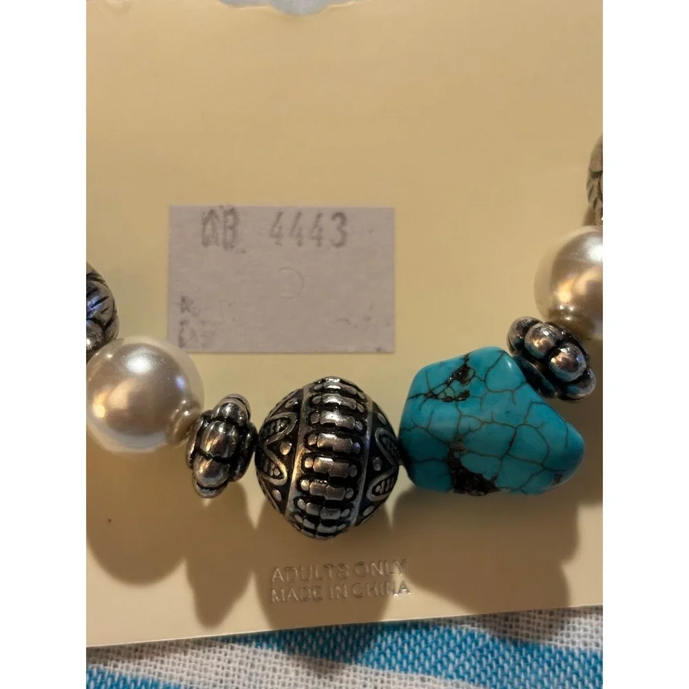 #23. Native American stretch, feather charm bracelet.